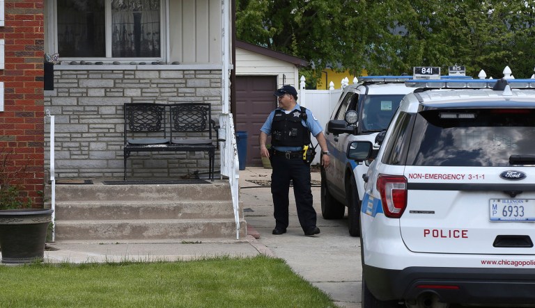 Chicago police watch over a home in Chicago, Wednesday, May 15, 2019, where Marlen Ochoa-Lopez was found strangled and her baby cut from her womb. Police and family members said Ochoa-Lopez went to the home in response to a Facebook offer of free baby clothes. 