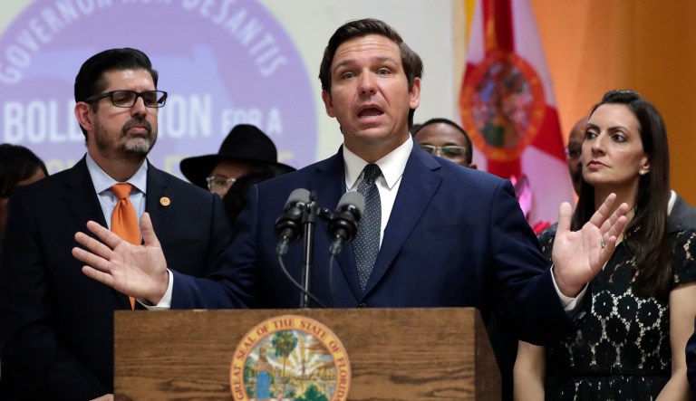 Florida Gov. Ron DeSantis (center) speaks at an event.