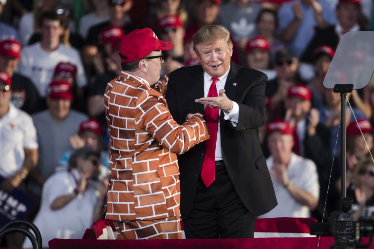 President Donald Trump, right, brings Blake Marnell on stage during a campaign rally in Montoursville, Pa.