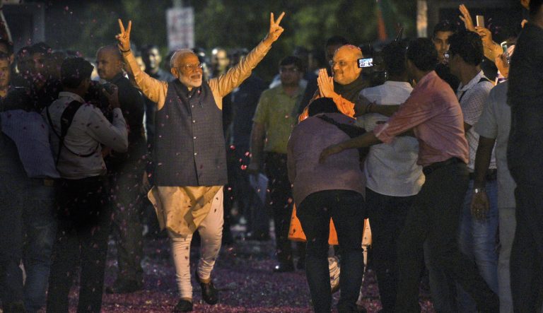 Indian Prime Minister Narendra Modi and Bharatiya Janata Party (BJP) President Amit Shah greet supporters on arrival at the party headquarters in New Delhi, India, Thursday, May 23, 2019. 