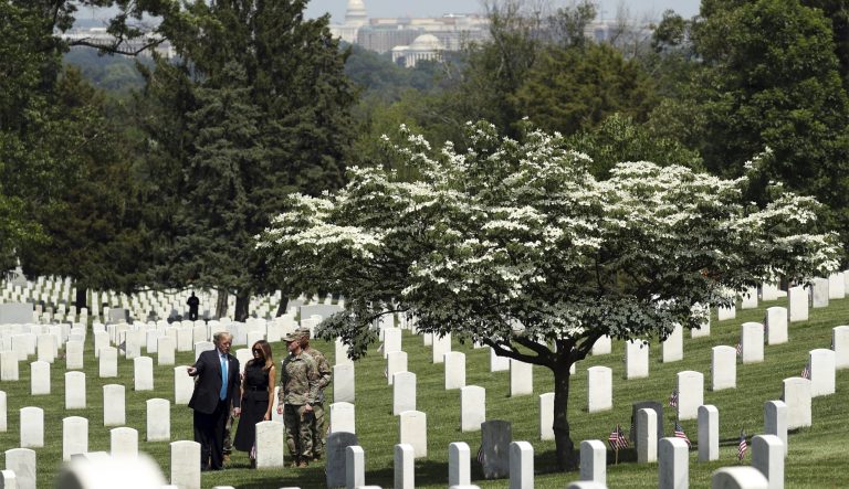 President Donald Trump and first lady Melania Trump visit Arlington National Cemetery for the annual Flags In ceremony ahead of Memorial Day Thursday, May 23, 2019, in Arlington, Va. 