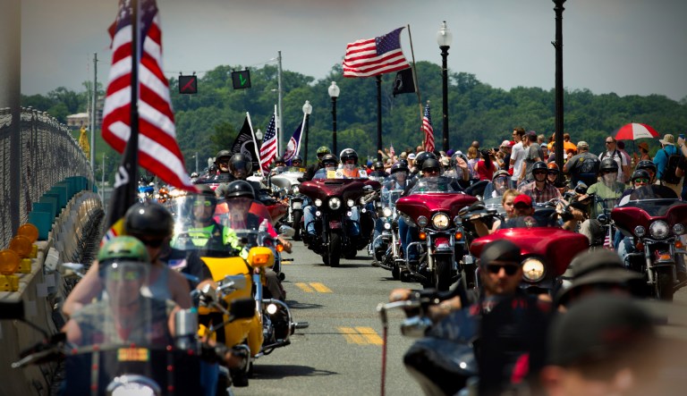 Participants in the Rolling Thunder motorcycle rally, ride past Arlington Memorial Bridge, during the annual Rolling Thunder parade, ahead of Memorial Day on Sunday, May 26, 2019, in Washington.