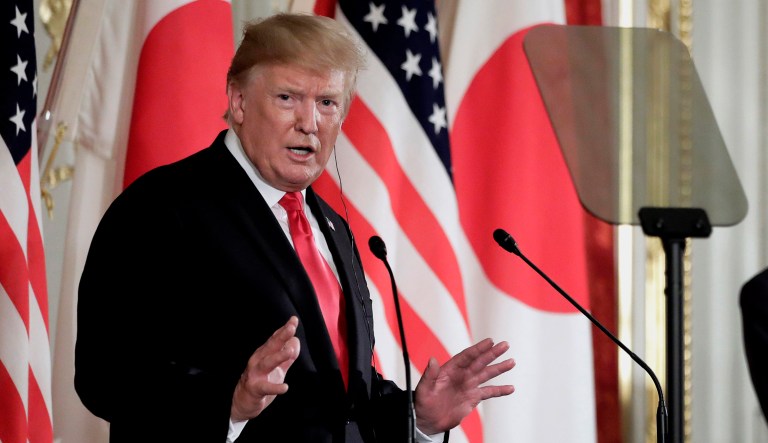 President Trump speaks at a press conference in Japan.