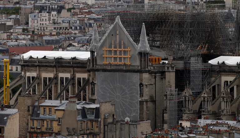 View of Notre Dame Cathedral from the top of the Tour Saint Jacques, in Paris, Friday May 31, 2019. Saint-Jacques Tower, 52-metre (171 ft) flamboyant Gothic tower is all that remains of the former 16th-century Church of Saint-Jacques-de-la-Boucherie ("Saint James of the butchers"), which was demolished in 1797, during the French Revolution, leaving only the tower.