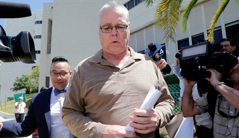 Scot Peterson, center, leaves the Broward County Jail after posting bond, Thursday, June 6, 2019, in Fort Lauderdale, Fla. Peterson, who was the assigned resource officer at Marjory Stoneman Douglas High School, has been charged with 11 criminal counts after failing to confront the gunman in the Parkland school massacre. At left his attorney Joseph DiRuzzo.