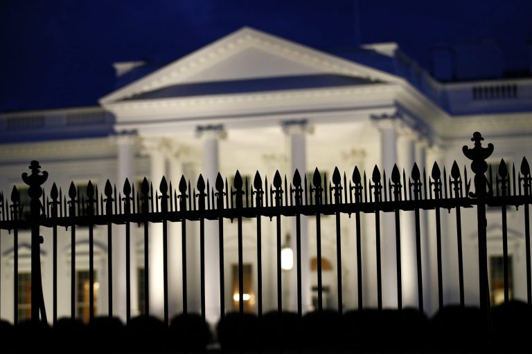 A fence stands in front of the White House at dusk, Thursday, June 6, 2019, in Washington.
