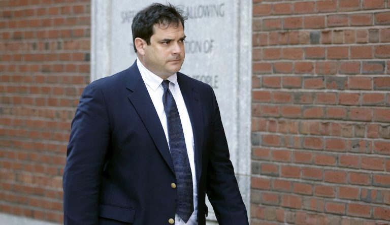 In this March 12, 2019 photo, John Vandemoer, former head sailing coach at Stanford, arrives at federal court in Boston to plead guilty to charges in a nationwide college admissions bribery scandal. 