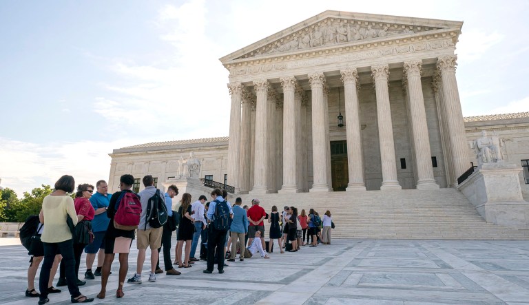 Visitors line up at the Supreme Court in Washington as the justices prepare to hand down decisions on Monday.