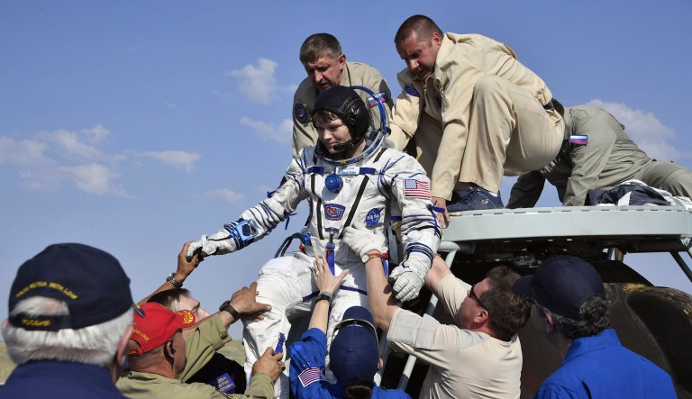 A Russian space agency rescue team help U.S. astronaut Anne McClain out from the capsule shortly after the landing of the Russian Soyuz MS-11 space capsule about 150 km (80 miles) south-east of the Kazakh town of Zhezkazgan, Kazakhstan.