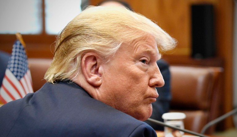 President Trump attends a meeting.