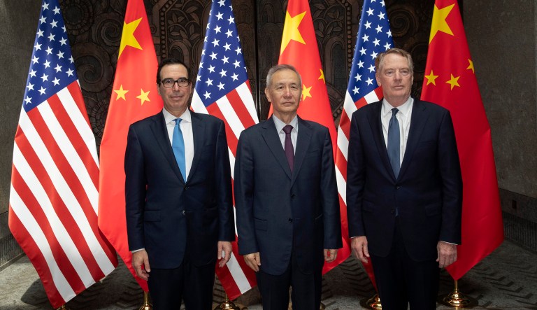 Chinese Vice Premier Liu He, center, poses with U.S. Trade Representative Robert Lighthizer, right, and Treasury Secretary Steven Mnuchin pose for photos before holding talks at the Xijiao Conference Center in Shanghai.