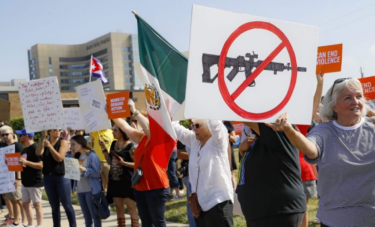 Demonstrators gather to protest the arrival of President Donald Trump outside Miami Valley Hospital after a mass shooting that occurred in the Oregon District early Sunday morning, Wednesday, Aug. 7, 2019, in Dayton. President Donald Trump is headed to Dayton and El Paso, Texas on Wednesday to offer a message of healing and unity, but he will be met by unusual hostility in both places by people who fault his own incendiary words as a contributing cause to the mass shootings . 