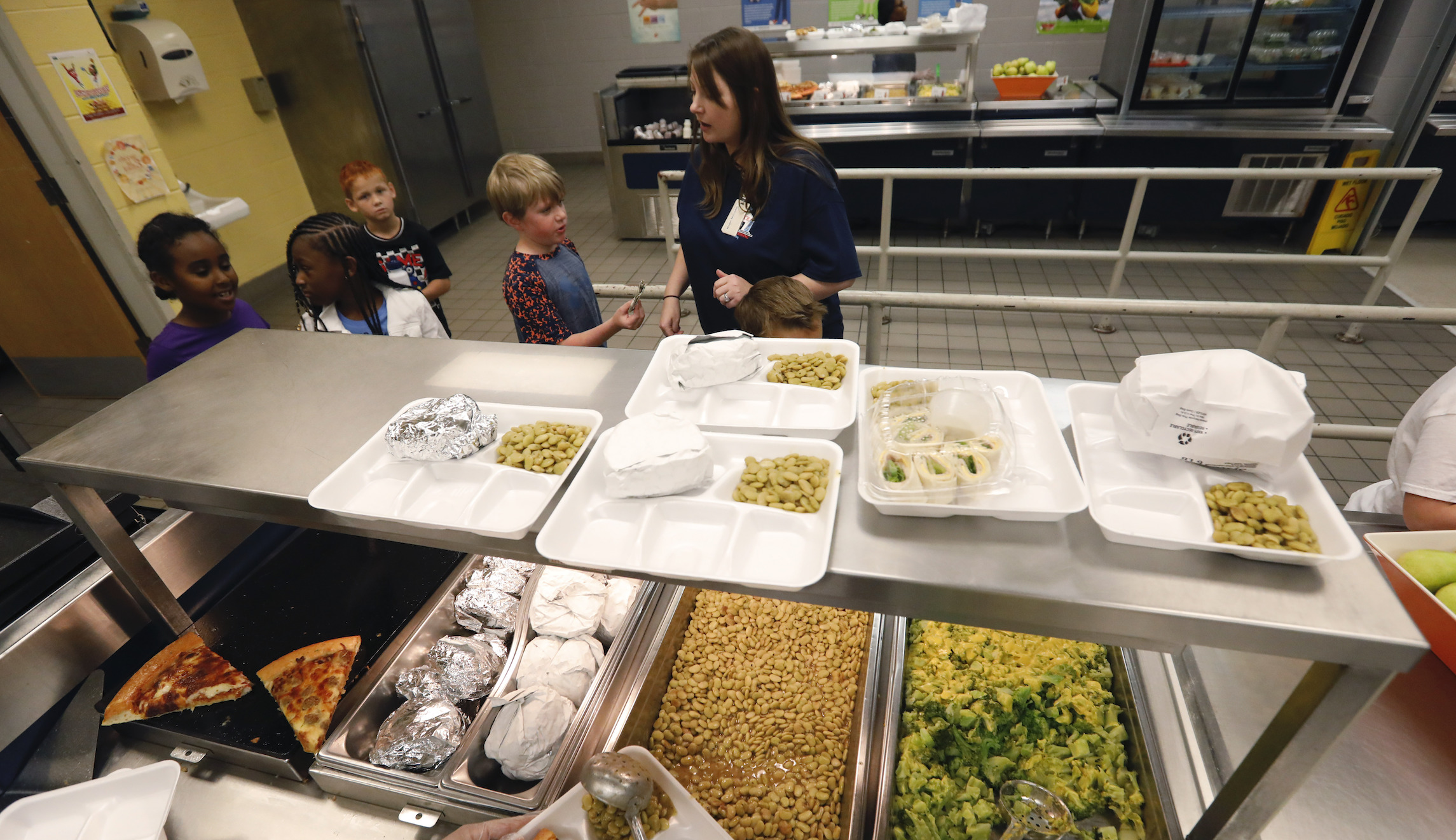 Man cuts a check to cancel the lunch debt for every student in a Florida public school