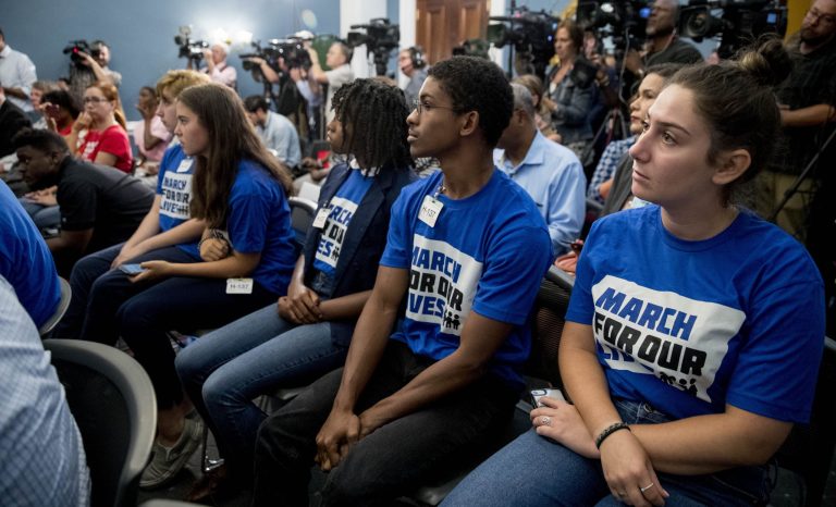 Members of the audience wear March For Our Lives shirts as House Majority Leader Steny Hoyer of Md., Rep. Debbie Dingell, D-Mich., Rep. Anthony Brown, D-Md., and others, hold a news conference calling for Senate action on H.R. 8 - Bipartisan Background Checks Act of 2019 on Capitol Hill in Washington, Tuesday, Aug. 13, 2019. 