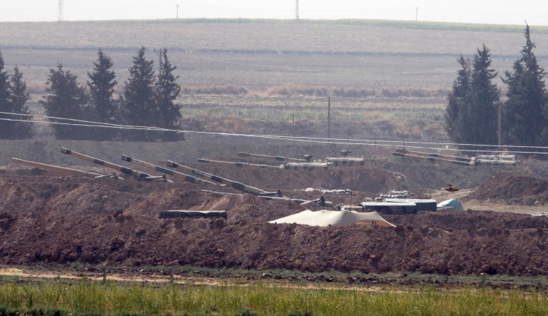 In this Sunday, Oct. 6, 2019 photo, Turkish forces artillery pieces are seen on their new positions near the border with Syria in Sanliurfa province, Turkey. 
