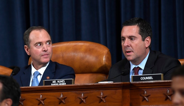 Chairman of the House Intelligence Committee Adam Schiff, D-Calif., left, listens as ranking member Rep. Devin Nunes, R-Calif., questions former U.S. Ambassador to Ukraine Marie Yovanovitch at the House Intelligence Committee last Friday. He hearings are not hurting President Trump's approval ratings.