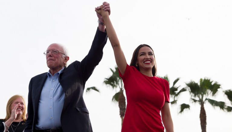 Democratic presidential candidate Sen. Bernie Sanders, I-Vt., and Rep. Alexandria Ocasio-Cortez, D-N.Y., greet the crowd during a rally in Venice, Calif., Saturday, Dec. 21, 2019.