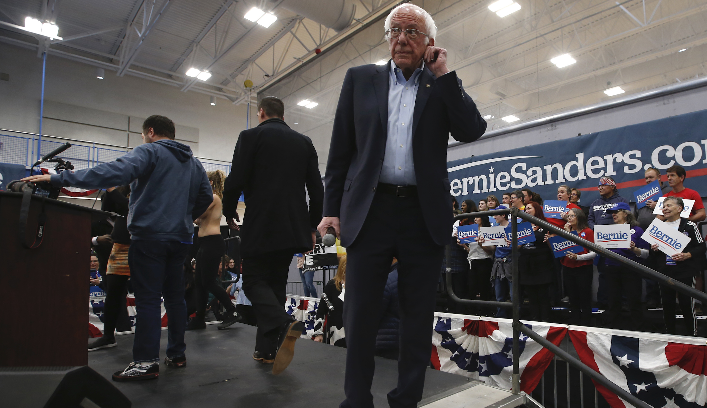 Topless protesters arrested after leaping on stage at Bernie Sanders Nevada rally