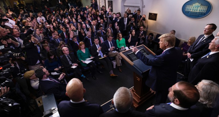 Trump offers coronavirus reassurance as he tries to end days of mixed messaging and market free fall