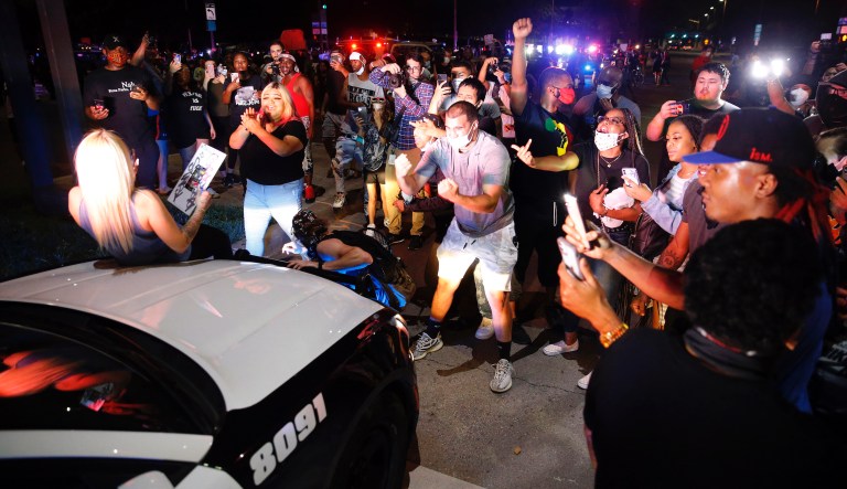 Man beaten in viral video while defending neighborhood during riots in stable condition, police say