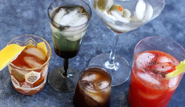 Several mixed cocktails are shown: from left, an old fashioned, a vodka gimlet, a Bull Shot, a dry martini and a bloody mary.