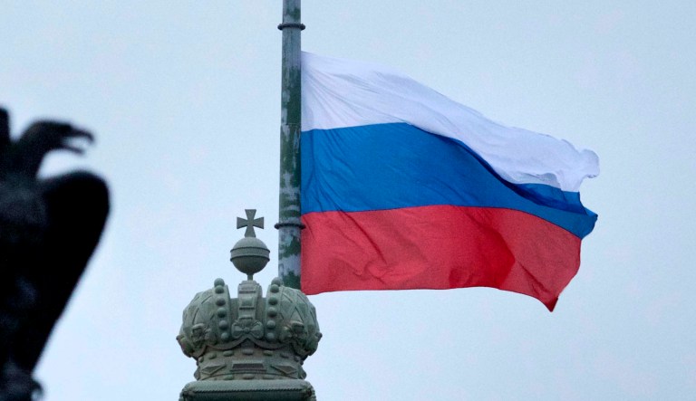 A Russian national flag flies at half staff at Dvortsovaya (Palace) Square in St. Petersburg, Russia.