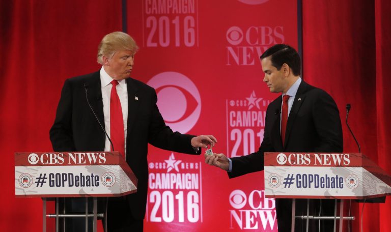 Republican presidential candidate, Sen. Marco Rubio, R-Fla., shares a container of Tic-Tac candies with Republican presidential candidate, businessman Donald Trump during the CBS News Republican presidential debate at the Peace Center, Saturday, Feb. 13, 2016, in Greenville, S.C.