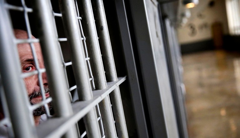 A prisoner is seen in a prison cell.
