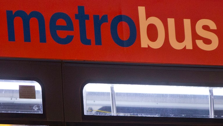 A man sits alone inside a Metrobus in downtown Washington.