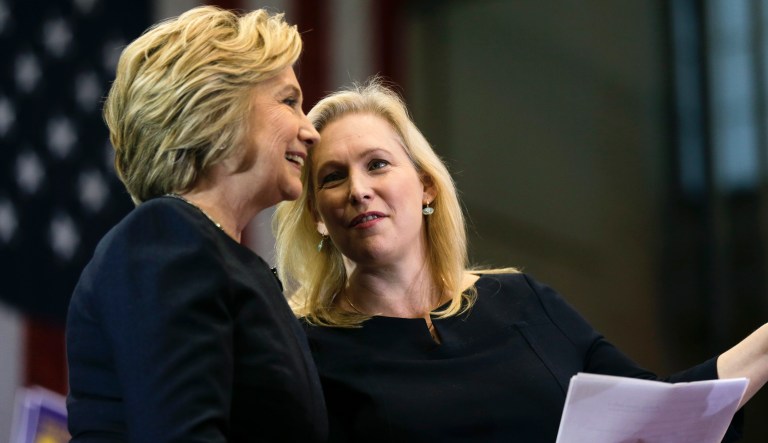 Democratic presidential candidate Hillary Clinton, left, and Sen. Kirsten Gillibrand, D-N.Y., talk during a rally at Cohoes High School on Monday, April 4, 2016, in Cohoes, N.Y.