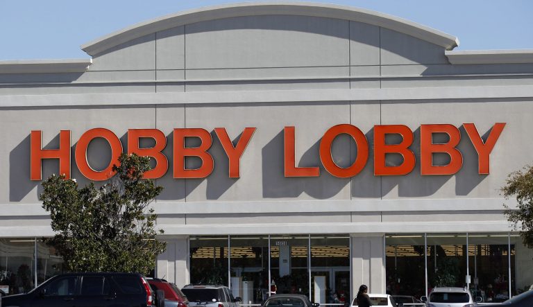 Customers walk into a Hobby Lobby Thursday, Nov. 1, 2012, in Dallas.