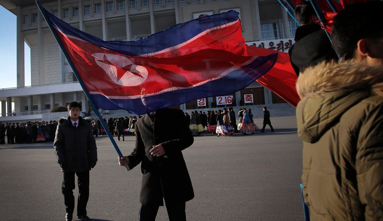 A North Korean man carries his country's national flag after celebrations of the "Day of the Shining Star" or birthday anniversary of late North Korean leader Kim Jong Il on Tuesday, Feb. 16, 2016, in Pyongyang, North Korea. The celebrations of Kim's birthday anniversary, a revered national holiday, came as South Koreaâs president warned that North Korea faces collapse if it doesnât abandon its nuclear weapons program, amid an international outcry over Pyongyangâs January nuclear test and the Feb. 7 rocket launch.