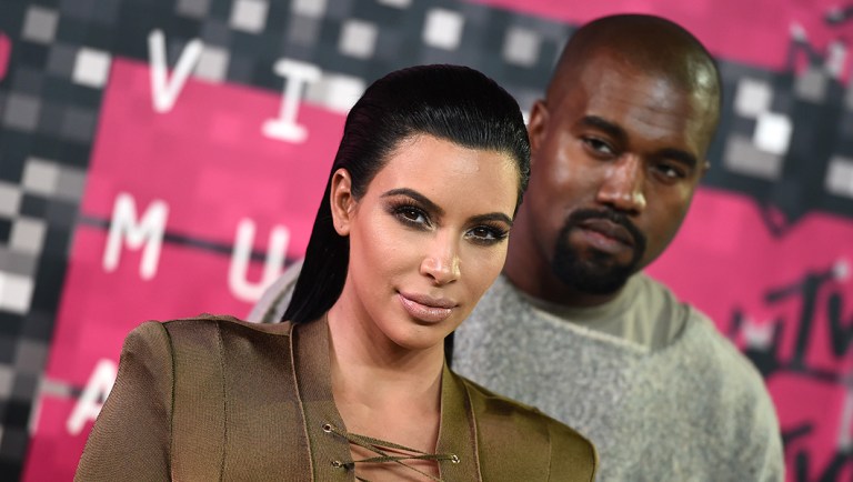 Kim Kardashian, left, and Kanye West arrive at the MTV Video Music Awards.