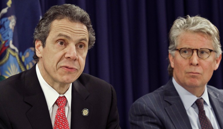 Manhattan District Attorney Cyrus Vance listens as Gov. Andrew Cuomo speaks during a news conference on April 9, 2013, in New York.