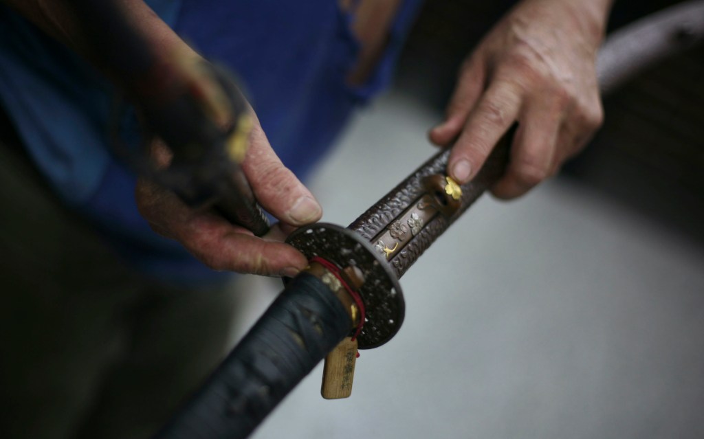 Man allegedly severs woman’s head with sword