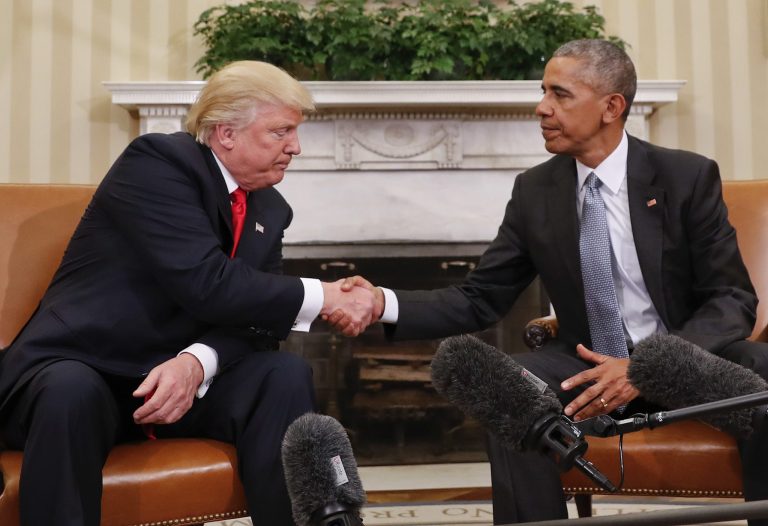 In this Nov. 10, 2016 photo, President Barack Obama and President-elect Donald Trump shake hands following their meeting in the Oval Office of the White House in Washington. Under Trump, American satisfaction with the way things are going has soared, said Gallup.