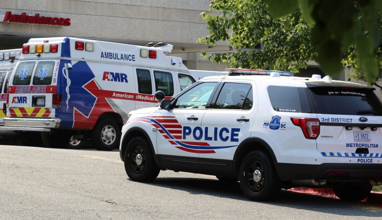 A police car and ambulances are seen outside of the emergency entrance at MedStar Washington Hospital Center in Washington.
