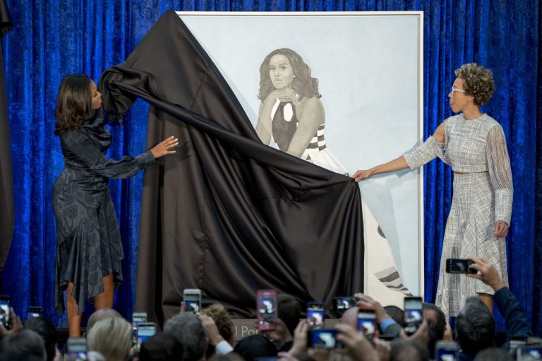 Former first lady Michelle Obama and Artist Amy Sherald, right, unveil Michelle Obama's official portrait at the Smithsonian's National Portrait Gallery, Monday, Feb. 12, 2018, in Washington. She's a popular pick to be Joe Biden's running mate.