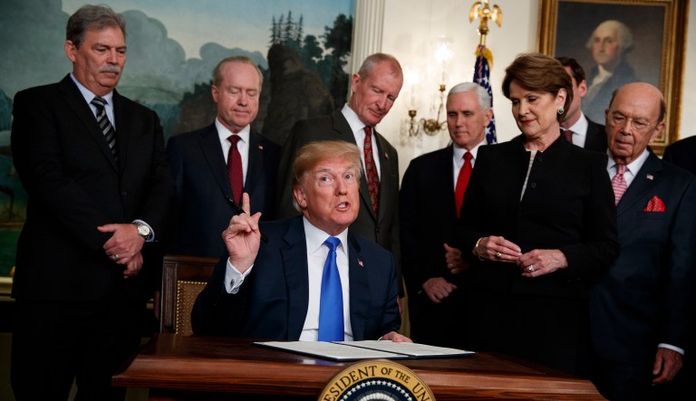 President Trump speaks before he signs a presidential memorandum imposing tariffs and investment restrictions on China in the Diplomatic Reception Room of the White House, Thursday. 