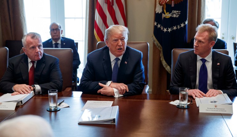 President Trump speaks as Acting Secretary of State John Sullivan, left, and Deputy Secretary of Defense Patrick Shanahan, listen during a cabinet meeting at the White House.