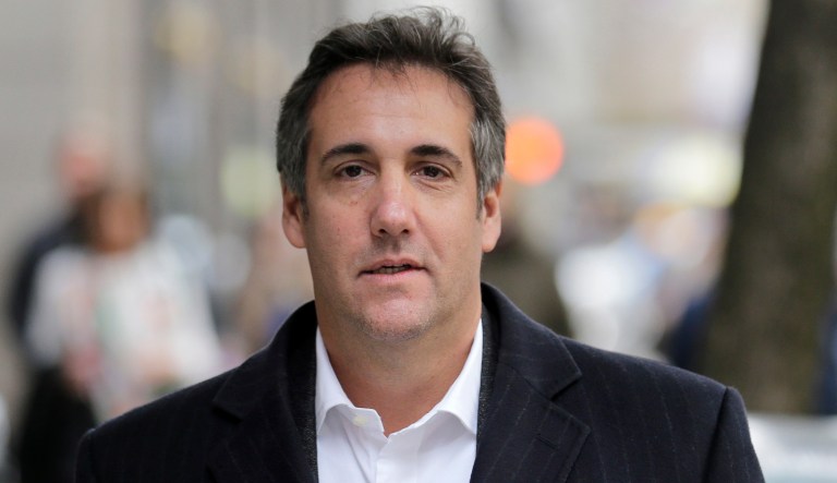 President Trump's personal attorney, Michael Cohen, walks down the sidewalk in New York.  