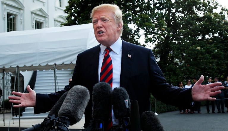 President Trump speaks to reporters before leaving the White House in Washington to attend the G7 Summit in Charlevoix, Quebec, Canada. 