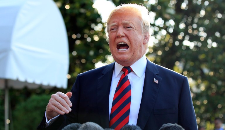 President Trump speaks to reporters before leaving the White House in Washington to attend the G7 Summit in Charlevoix, Quebec, Canada. 