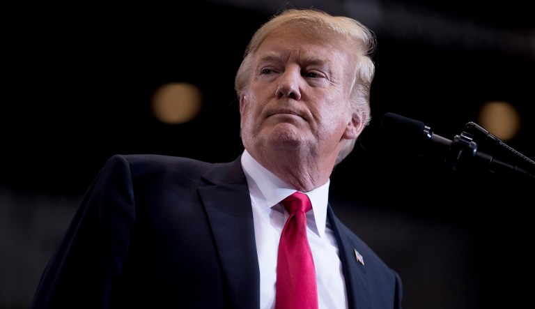 President Trump pauses while speaking at a rally. 