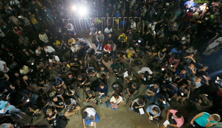 Thai media listen to Chiang Rai province acting Gov. Narongsak Osatanakorn, who led the rescue operation of a soccer team and coach trapped in a flooded cave.