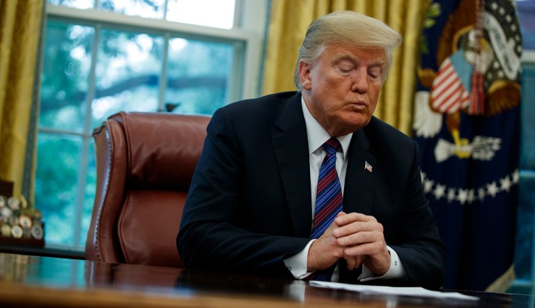 President Trump talks on the phone with Mexican President Enrique Pena Nieto, in the Oval Office of the White House, Aug. 27, 2018.