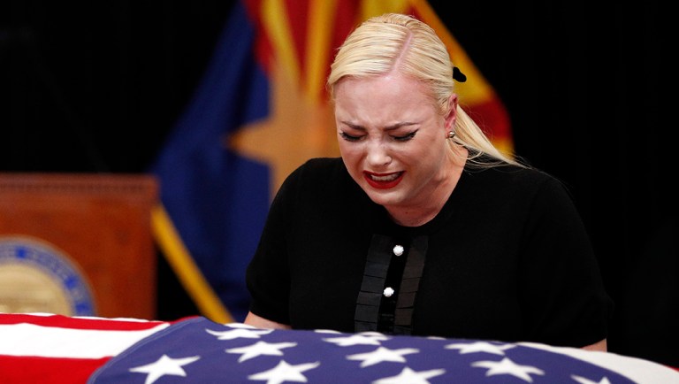 Meghan McCain, daughter of Sen. John McCain cries at the casket of her father during a memorial service at the Arizona Capitol.