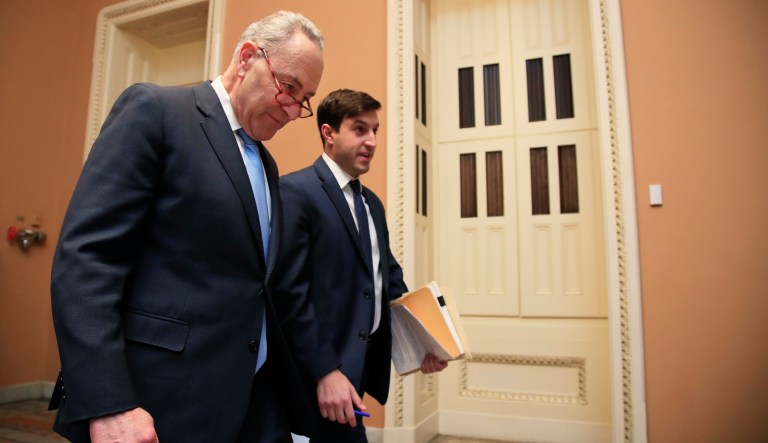 Senate Minority Leader Chuck Schumer, D-N.Y., walks with an aide on Capitol Hill in Washington, Tuesday, Jan. 8, 2019.