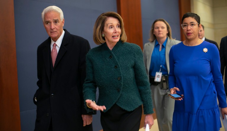 Speaker of the House Nancy Pelosi, D-Calif., joined at left by Rep. Charlie Crist, D-Fla., arrives for a classified briefing for House members by Treasury Secretary Steven Mnuchin about U.S. sanctions on the Russian oligarch Oleg Deripaska, on Capitol Hill in Washington, Thursday, Jan. 10, 2019. 