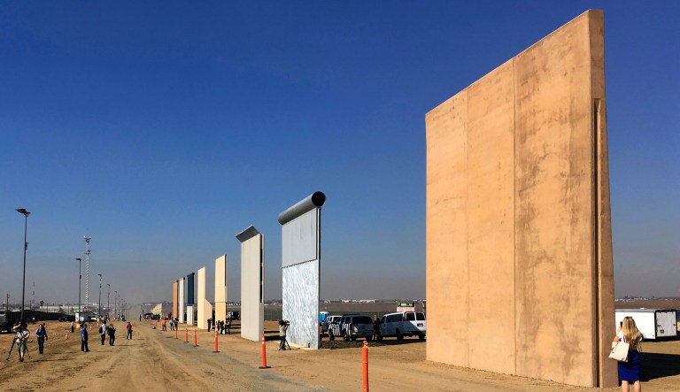 This Oct. 26, 2017, file photo shows prototypes of border walls in San Diego. In his demands that Congress set aside $5.7 billion for a border wall, President Trump insists a physical barrier would stop heroin entering the U.S. from Mexico. 